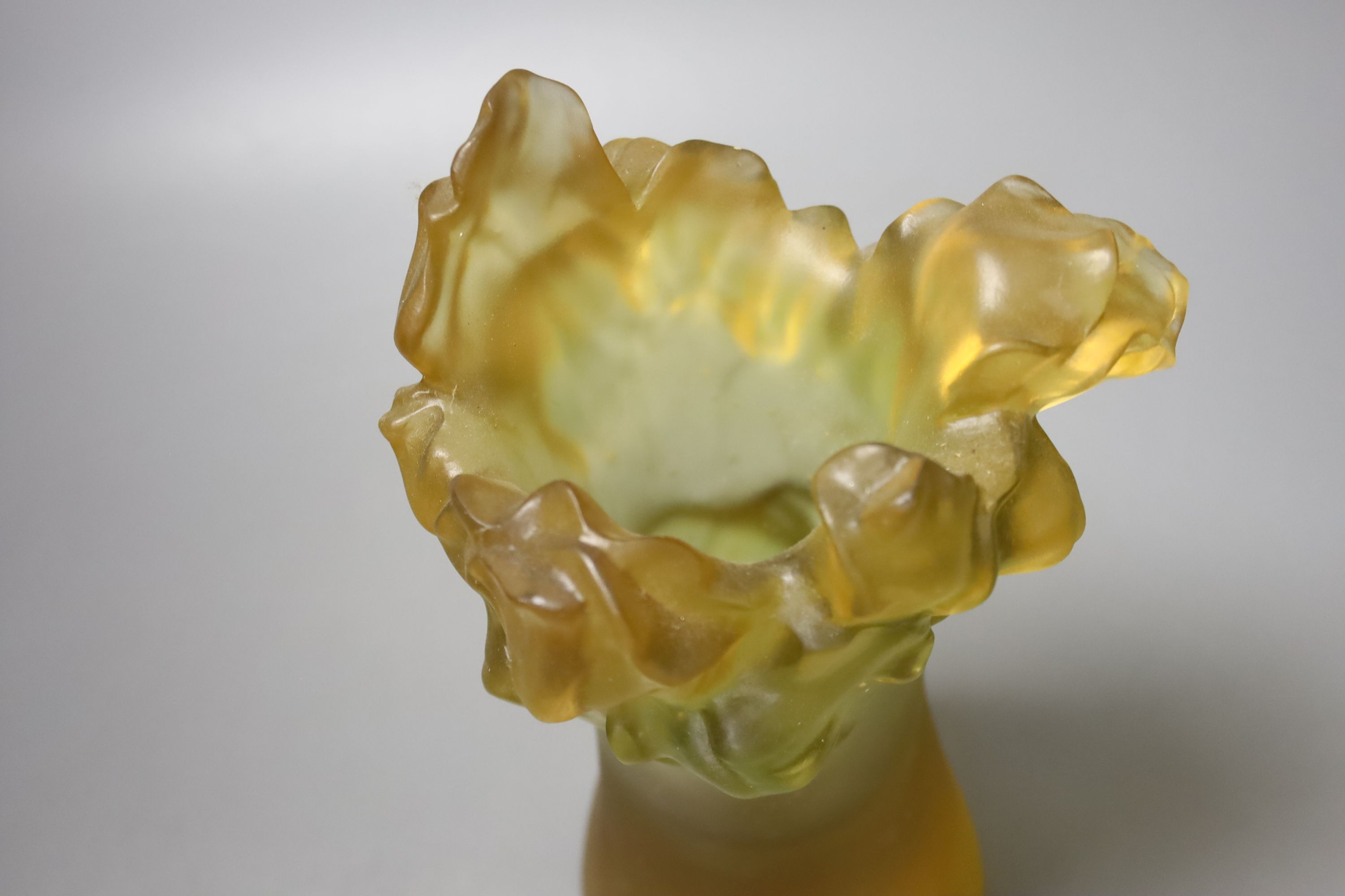 An amber vase with a nude study in relief, apocryphal Daum mark, 24cm high